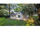 Small brick guest house with a covered patio and side yard at 37439 Meridian Ave, Dade City, FL 33525