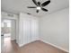 Bright bedroom with ceiling fan and view of bathroom at 9126 109Th Ter, Seminole, FL 33777