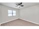 Spacious bedroom featuring a ceiling fan and large window at 9126 109Th Ter, Seminole, FL 33777
