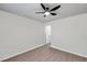 Light-filled bedroom with ceiling fan and access to bathroom at 9126 109Th Ter, Seminole, FL 33777