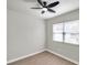 Well-lit bedroom with ceiling fan and wood-look flooring at 9126 109Th Ter, Seminole, FL 33777