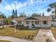 Well-maintained home with a spacious driveway and mature trees at 9126 109Th Ter, Seminole, FL 33777