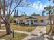 Move-in ready home with a freshly painted exterior and new landscaping at 9126 109Th Ter, Seminole, FL 33777