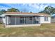Charming house exterior with a screened patio at 9126 109Th Ter, Seminole, FL 33777