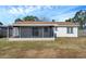 Renovated house exterior and spacious backyard at 9126 109Th Ter, Seminole, FL 33777