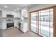 Modern white kitchen with stainless steel appliances and quartz countertops at 9126 109Th Ter, Seminole, FL 33777