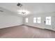 Spacious living room featuring hardwood floors and a modern light fixture at 9126 109Th Ter, Seminole, FL 33777