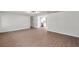 Open concept living room with kitchen view and hardwood floors at 9126 109Th Ter, Seminole, FL 33777