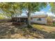 House backyard view with a screened porch at 1025 Fairwood Ave, Clearwater, FL 33759