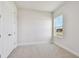 Bright bedroom features a large window and plush neutral carpet at 11826 Richmond Trl, Parrish, FL 34219