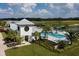 Community clubhouse with pool and landscaping at 11826 Richmond Trl, Parrish, FL 34219