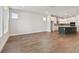 Modern kitchen featuring stainless steel appliances and an island, and hardwood flooring at 11826 Richmond Trl, Parrish, FL 34219
