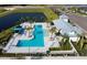 Community pool with surrounding lounge chairs and landscaping at 11826 Richmond Trl, Parrish, FL 34219