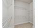 A walk-in closet with white walls and white wire shelving at 11826 Richmond Trl, Parrish, FL 34219