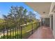 Balcony overlooking a lush green landscape with trees and pathways at 125 Mariner Dr # 125, Tarpon Springs, FL 34689