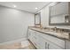Double vanity bathroom with granite countertop and modern fixtures at 125 Mariner Dr # 125, Tarpon Springs, FL 34689