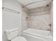Clean bathroom with a bathtub, shower, and tiled walls at 125 Mariner Dr # 125, Tarpon Springs, FL 34689