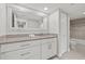 Bathroom with granite vanity, large mirror, and tub/shower combo at 125 Mariner Dr # 125, Tarpon Springs, FL 34689