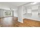 Spacious bedroom with wood floors, large window, and walk-in closet at 125 Mariner Dr # 125, Tarpon Springs, FL 34689