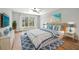 Spacious bedroom with light walls and blue bedding at 125 Mariner Dr # 125, Tarpon Springs, FL 34689