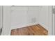 Well-lit closet with wood flooring and hanging rod at 125 Mariner Dr # 125, Tarpon Springs, FL 34689