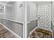 Apartment hallway with gray walls, carpet flooring, and a white door at 125 Mariner Dr # 125, Tarpon Springs, FL 34689