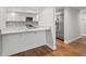 Kitchen with granite countertop breakfast bar and stainless steel appliances at 125 Mariner Dr # 125, Tarpon Springs, FL 34689