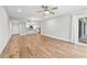 Bright living room with hardwood floors and access to a balcony at 125 Mariner Dr # 125, Tarpon Springs, FL 34689