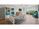 Home office with built-in shelving and hardwood floors at 125 Mariner Dr # 125, Tarpon Springs, FL 34689