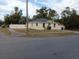 Newly constructed home with a fenced yard and paved driveway at 1302 E Annie St, Tampa, FL 33612