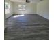 Large living room featuring wood-look vinyl flooring at 1302 E Annie St, Tampa, FL 33612