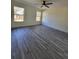 Bright and airy living room with wood-look flooring at 1302 E Annie St, Tampa, FL 33612
