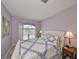 Main bedroom with queen bed and large window at 1414 Alhambra Dr, Apollo Beach, FL 33572
