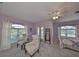 Main bedroom with sitting area and balcony access at 1414 Alhambra Dr, Apollo Beach, FL 33572