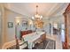 Formal dining room with chandelier and built-in hutch at 1414 Alhambra Dr, Apollo Beach, FL 33572
