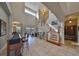 Two-story foyer with views of the backyard and staircase at 1414 Alhambra Dr, Apollo Beach, FL 33572
