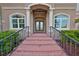 Elegant entryway with double doors and wrought iron railings at 1414 Alhambra Dr, Apollo Beach, FL 33572