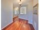 Hardwood floor hallway with access to bedrooms at 1414 Alhambra Dr, Apollo Beach, FL 33572