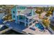 Beautiful home with multi-level decks, water access, private boat lift, and in-ground pool and spa at 17410 1St E St, Redington Shores, FL 33708