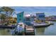 Coastal home featuring a private dock, boat, outdoor lounge and a multi-level terrace at 17410 1St E St, Redington Shores, FL 33708