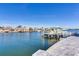 Scenic waterfront view showcases a private dock and boat lift amid a tranquil bay setting at 17410 1St E St, Redington Shores, FL 33708