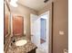 Bathroom features granite vanity and updated fixtures at 7805 Pine Trace Dr, Sarasota, FL 34243