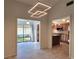 Modern dining room with kitchen and screened porch view at 7805 Pine Trace Dr, Sarasota, FL 34243