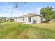 View of the back of the house and backyard at 4427 Ashton Meadows Way, Wesley Chapel, FL 33543