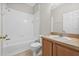 Clean bathroom with a shower/tub combo and wood vanity at 4427 Ashton Meadows Way, Wesley Chapel, FL 33543