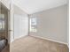 Well-lit bedroom featuring a window and double-door closet at 4427 Ashton Meadows Way, Wesley Chapel, FL 33543