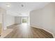 Bright living room with wood-look floors and sliding glass doors at 4427 Ashton Meadows Way, Wesley Chapel, FL 33543