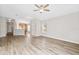 Bright and airy living room with wood-look floors at 4427 Ashton Meadows Way, Wesley Chapel, FL 33543