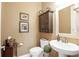 Convenient bathroom with sink, toilet, and cabinet at 6007 Burrowing Owl Pl, Lithia, FL 33547