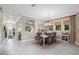 Bright dining area with a farmhouse table and access to the Gathering room at 6007 Burrowing Owl Pl, Lithia, FL 33547